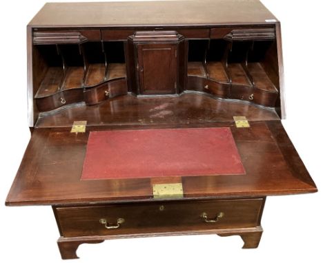 A fine quality Irish Georgian period mahogany slope front Bureau, the lift top opening to reveal a fitted interior with leath