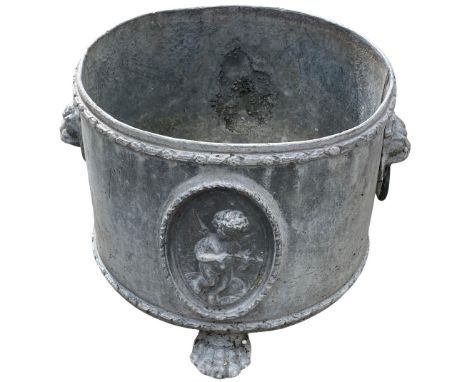 A good cylindrical&nbsp;lead Planter, relief moulded with panels of cherubs and lion mask handles on lion paw feet, 25cms h x