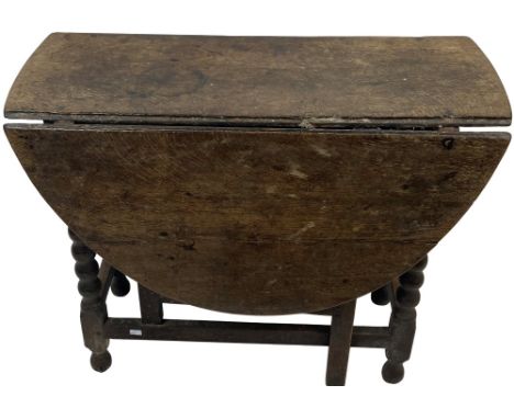 A good 18th Century style oak drop-leaf gate-leg Table, 19th Century, with demi-lune flaps on bead moulded legs, 88cms (34 1/