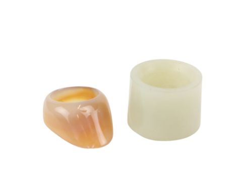 A Chinese jade Archer's Ring, and a Finger Guard. (2) 