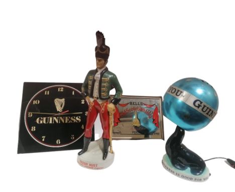 A porcelain 'Guinness is Good for You' Sea Lion Advertisement&nbsp;Lamp, with rotating metal pierced shade modelled as a ball