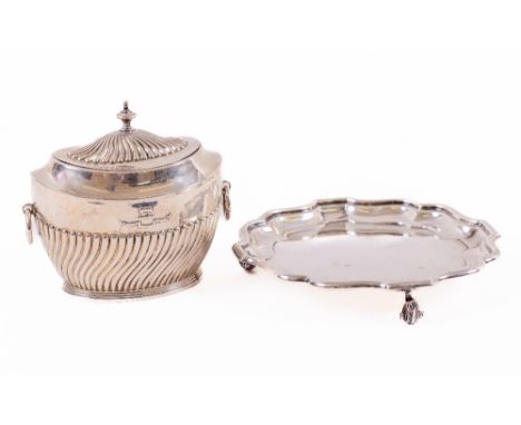 A small silver Card Tray, Birmingham 1905, 15cms (6") on three scroll legs; together with an oval silver Tea Caddy with half 