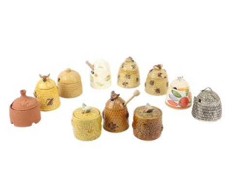 A collection of 11 various&nbsp;ceramic hive shaped Honey Pots, various makes and including a very heavy Godinger silver plat
