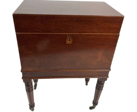 A rectangular mahogany&nbsp;Cellaret,&nbsp;George IV, the hinged top opening to reveal a divided interior and two outer brass