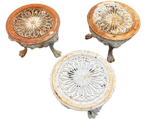 A set of 3 heavy cast iron Patio Stools or Planter Stands, each with circular pierced top on three ornate cabriole legs, 33cm