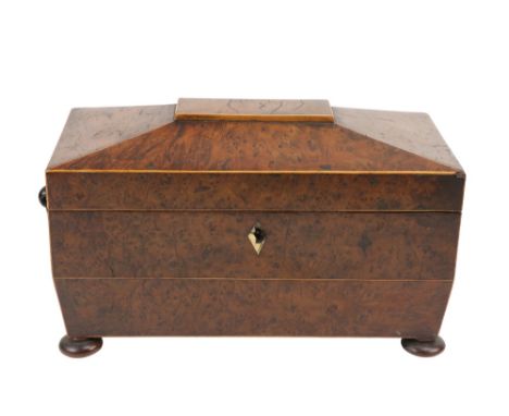 A William IV birds-eye-maple Tea Caddy, of casket form enclosing two lidded canisters and an associated tin caddy, the gables
