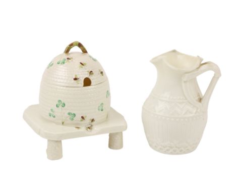 A First period Belleek harp handle Jug,&nbsp;(1863-1890) together with a Sixth period (1965-1980) Belleek basket moulded Hone