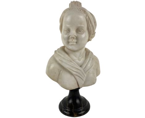 A small carved white marble Bust, of a young woman wearing a bonnet, on a dark veined marble socle, 31cms (12"). (1) 