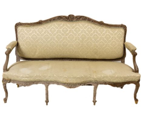 A French Louis XV style carved and painted Settee, the shaped back with a floral crest issuing leaf sprays and flowers, above