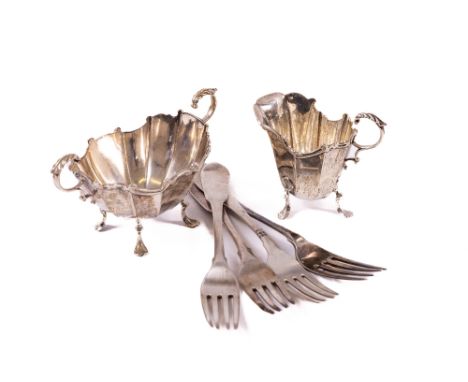 A Birmingham silver Sugar and Cream, the boat shaped double handled bowl on four legs and a matching Cream Jug c. 1916, a cas