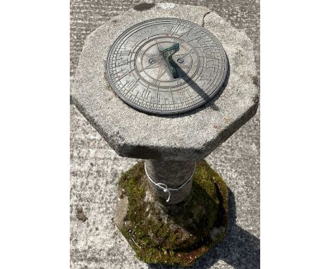 A small composition stone Sundial, with octagonal top and turned stem with metal sundial, 87cms (34"). (1) 