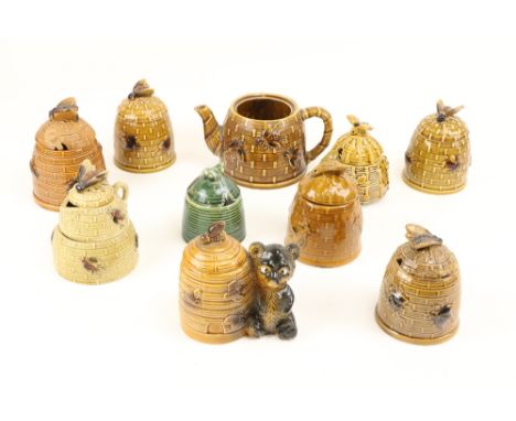 A collection of Devon, Portugal, Japanese and other beehive shaped and other ceramic Honey Pots. (10)&nbsp; 