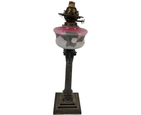 A good heavy 19th Century silver plated Table Lamp, with pink glass reservoir, on a Corinthian capital and fluted column on a