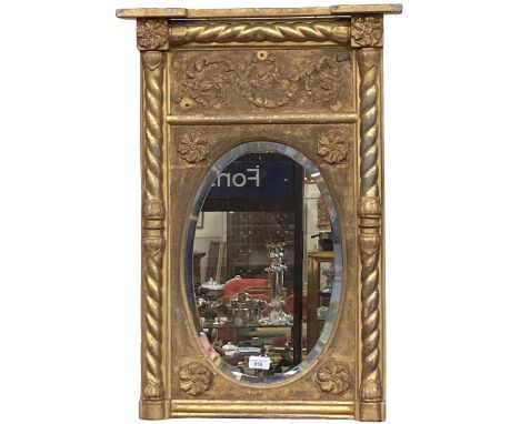A 19th Century Irish gilt Pier Mirror, with inverted breakfront cornice above a leaf moulded sanded frieze above an oval beve