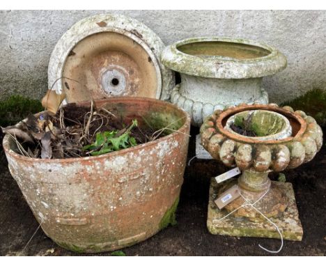 A large oval terracotta barrel shaped Planter, 38cms x 61cm (15" x 24") together with a small terracotta Urn and two large Ur