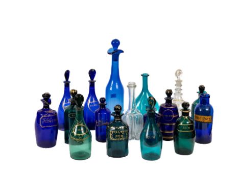 A collection of 19th Century coloured glass Decanters and Spirit Bottles, comprising a pair of oval multi-sided green and par