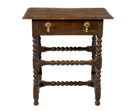 An 18th Century style oak Side Table, 19th Century, with rectangular moulded top above a frieze drawer on bobbin turned suppo