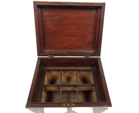 A good George IV inlaid mahogany casket shaped six division Decanter or Wine Bottle Cellaret, with hinged cover on ring turne