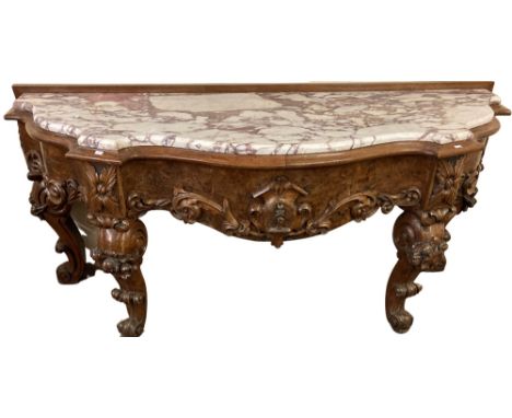 A good Victorian carved and crested walnut and birds-eye walnut Console Table,&nbsp;with serpentine front with white and red 