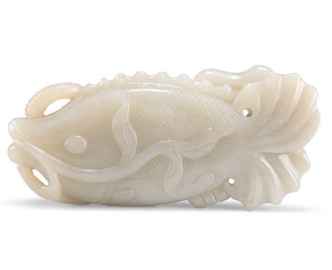 A JADE FISH AND LOTUS CARVING A JADE FISH AND LOTUS CARVING. 13.5cm by 6cmIn very good condition.