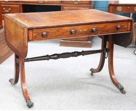 A REGENCY INLAID ROSEWOOD SOFA TABLE A REGENCY INLAID ROSEWOOD SOFA TABLE, the rectangular top with rounded corners to the le