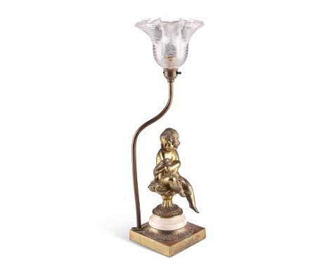 A FRENCH GILT-BRASS FIGURAL TABLE LAMP, CIRCA 1900 A FRENCH GILT-BRASS FIGURAL TABLE LAMP, CIRCA 1900, with moulded clear-gla