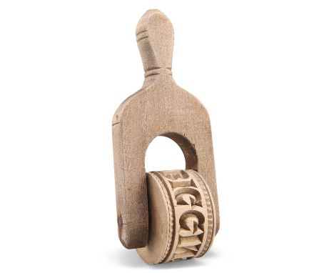 A NORTH COUNTRY TREEN BUTTER ROLLER, CIRCA 1880-1920 A NORTH COUNTRY TREEN BUTTER ROLLER, CIRCA 1880-1920, the roller carved 