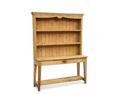 A PINE DRESSER AND RACK A PINE DRESSER AND RACK, the rectangular top above a frieze drawer, raised on square-section tapering