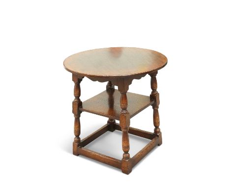 A SIESTA OAK TAVERN TABLE, IN PERIOD STYLE A SIESTA OAK TAVERN TABLE, IN PERIOD SYTLE, the circular top raised on block and b