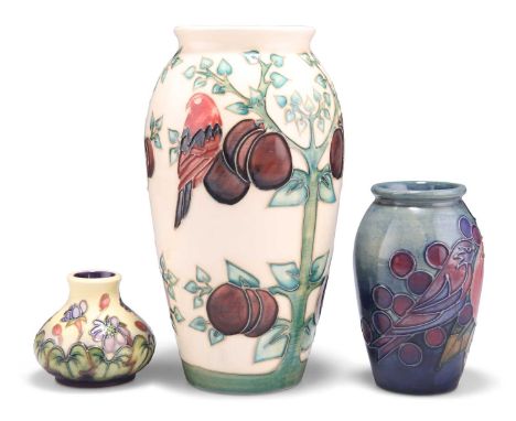 THREE MOORCROFT TUBE LINED POTTERY VASES A MOORCROFT LIMITED PLUM TREE AND BIRDS PATTERN TUBE LINED POTTERY VASE, designed by
