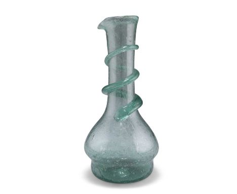 A LIGHT GREEN GLASS CARAFE, LATE 19TH CENTURY A LIGHT GREEN GLASS CARAFE, LATE 19TH CENTURY, the neck applied with spiral tra