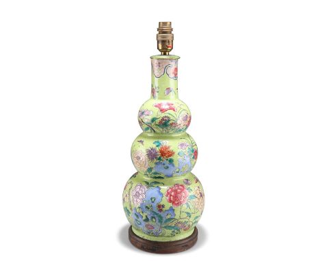A CHINESE ENAMEL DECORATED GOURD VASE, 19TH CENTURY A CHINESE ENAMEL DECORATED GOURD VASE, 19TH CENTURY, painted with flowers