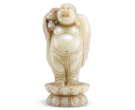 A JADE BUDAI CARVING A JADE BUDAI CARVING, standing upon a lotus throne with a sack slung over his shoulder. 12cm high