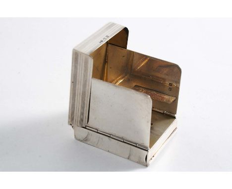 A RECTANGULAR VESTA CASE with engine-turned "striped" decoration, hinging open , releasing two spring loaded flaps to act as 