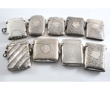 NINE VARIOUS EDWARDIAN VESTA CASES each with a vacant cartouche & a suspensory ring, mixed makers & dates 1901-1907; the larg