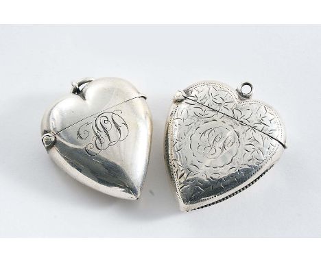 A LATE VICTORIAN PLAIN HEART-SHAPED VESTA CASE initialled, suspensory ring, maker's mark "M&L", Birmingham 1898, another hear