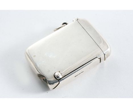 A LATE VICTORIAN PLAIN RECTANGULAR VESTA CASE incorporating a spring loaded cigar cutter along one side, accessed by a button