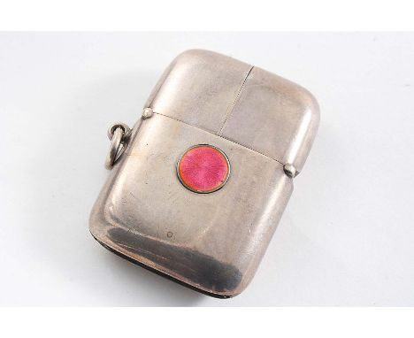 AN EDWARDIAN VESTA CASE with a pink enamelled button which, when depressed, causes the cover to spring open in two halves, gi