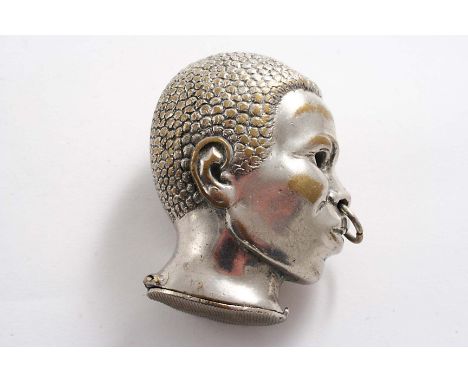 AN EARLY 20TH CENTURY NICKEL-PLATED VESTA CASE in the form of the head of a negress with a ring through her nose;  2.1"  (5.4