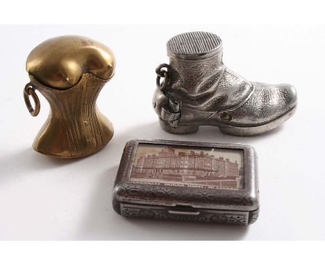 A LATE 19TH CENTURY BRASS NOVELTY VESTA CASE in the form of a young lady's torso barely wearing a corset, suspensory ring, a 