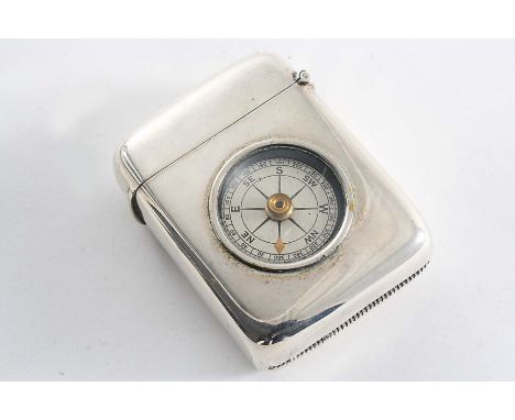 AN EDWARDIAN LARGE OBLONG VESTA CASE the front inset with a compass (behind glass), by T. Hayes, Birmingham 1906;  2.45"  (6.