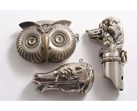 THREE LATE 19TH CENTURY PLATED VESTA CASES:- A dog's head vesta/whistle with suspensory ring, a racehore head vesta case and 