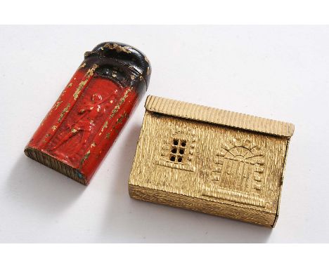 A RARE PAINTED BRASS VESTA CASE resembling a part-used stick of red sealing wax, c.1900 and a gilt brass vesta case resemblin