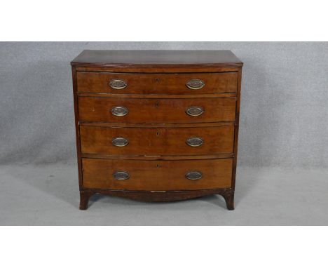 A Regency mahogany bowfronted chest of drawers with crossbanded and ebony strung top on swept bracket supports. H.86 W.89.5 D