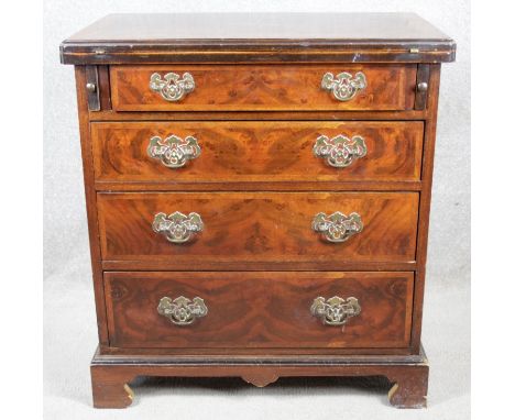 A mid Georgian style burr elm and walnut feather banded bachelors chest with star inlaid foldover top above four long graduat
