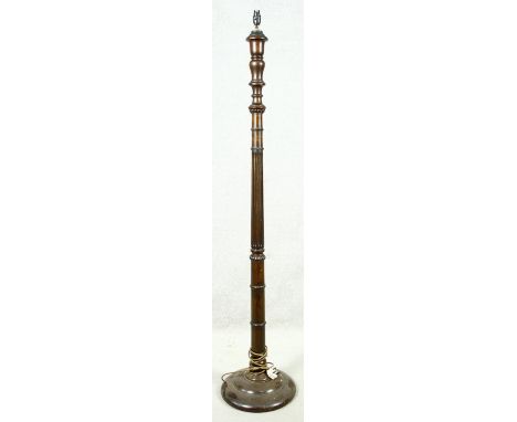 A vintage turned mahogany standard lamp on platform base. H.161cm 