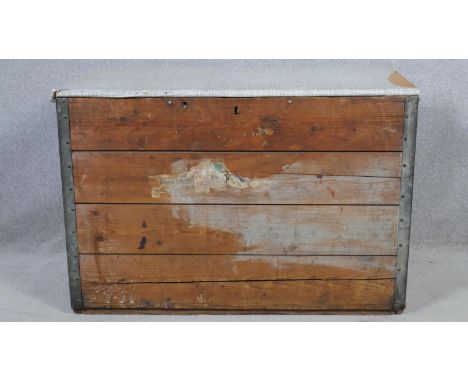A vintage metal bound travelling trunk with twin carrying handles. H.73 W.92 D.46cm 
