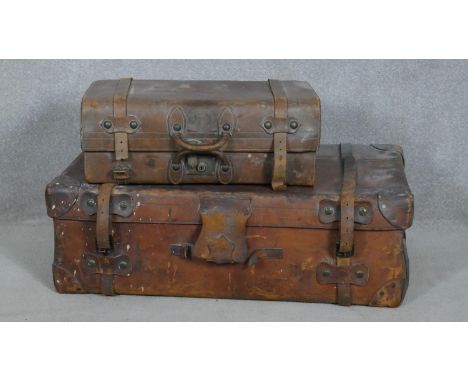 A vintage leather cabin trunk along with a similar case. H.52 L.92 W.31cm (Largest) 