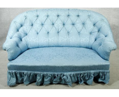 A vintage tub shaped two seater sofa in deep buttoned damask upholstery. H.94 W.150 D.90cm 