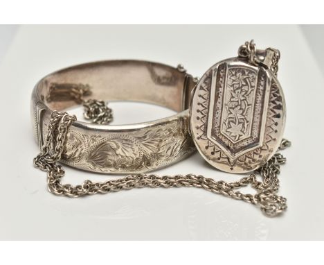 A SILVER LOCKET AND CHAIN WITH A BANGLE, oval foliage pattern hinged locket, hallmarked Birmingham import, fitted with a tape